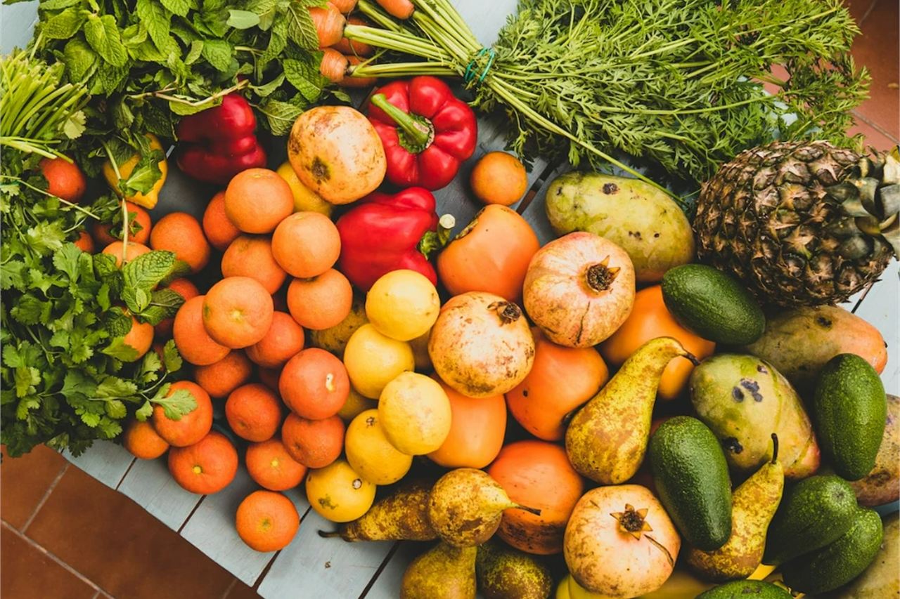 An assortment of fresh fruits and vegetables arranged on a table.