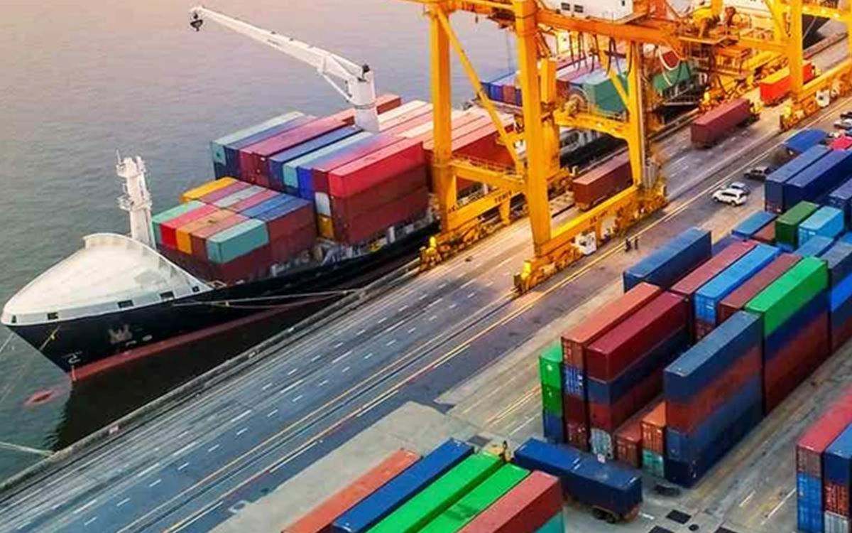Container vessel berthed alongside a port terminal.